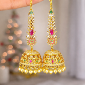 Ornate gold jhumka earrings with gemstones